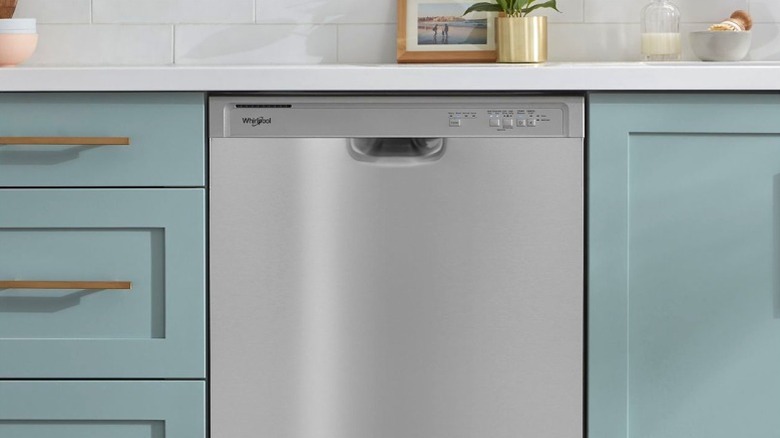 Whirlpool dishwasher under counter in a modern kitchen