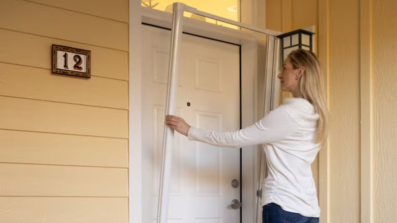 person installing the LARSON retractable screen door