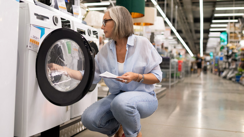 Woman shopping for a washing machine