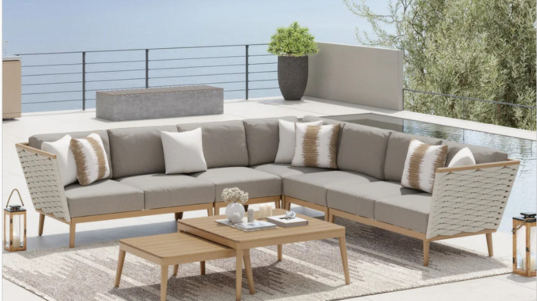 A luxury modular couch and nesting tables on a Mediterranean rooftop.
