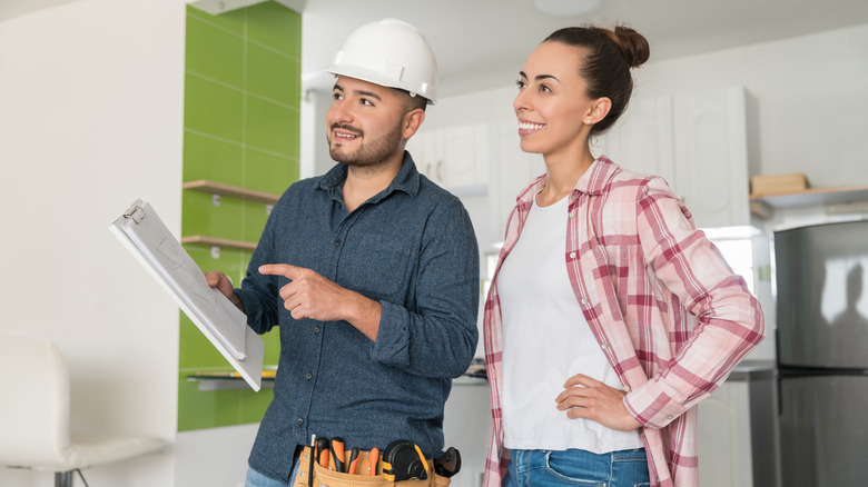 client and contractor discussing kitchen upgrades