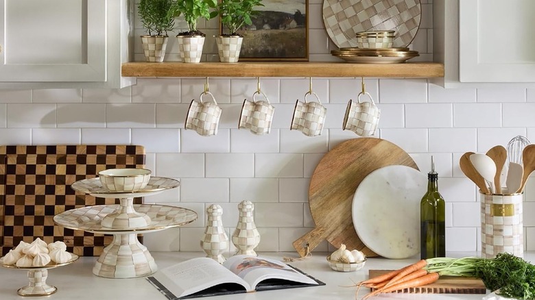 Checkered planter with a leafy plant by a window