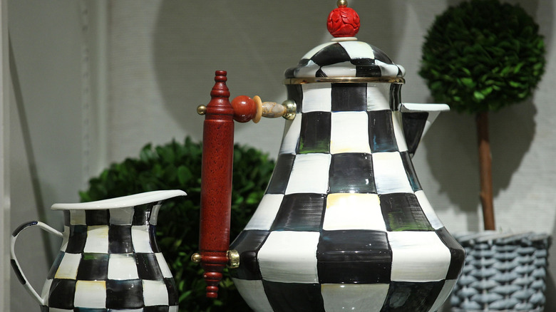 Closeup of Mackenzie-Childs checkered teapot and pitcher