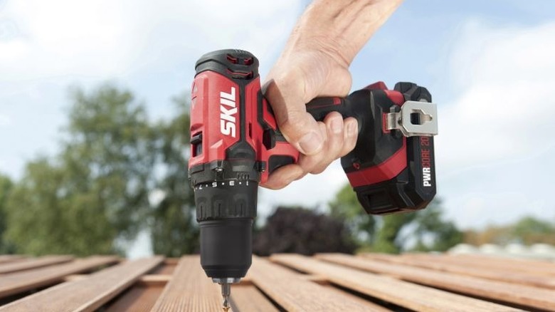 Man using a Skil cordless drill