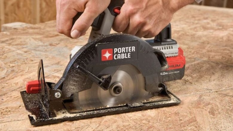 Close up of man using a Porter Cable power tool