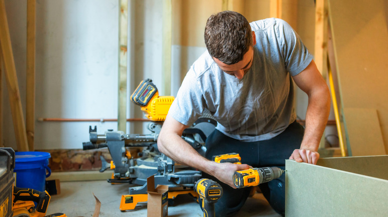 Carpenter using DeWalt power tools