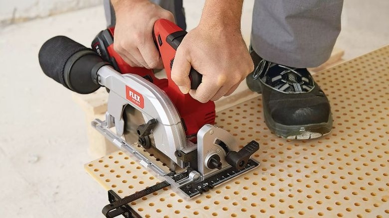 Man using a Flex cordless circular saw