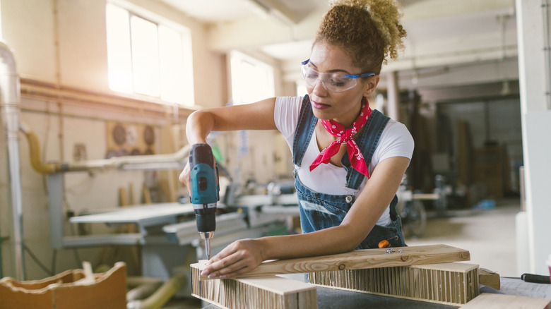 female worker using a cordless power tool
