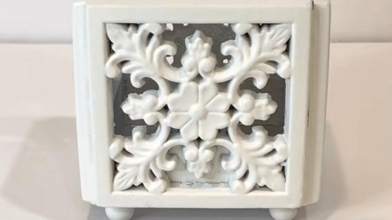 Candle holder made from wooden Dollar Tree supplies.