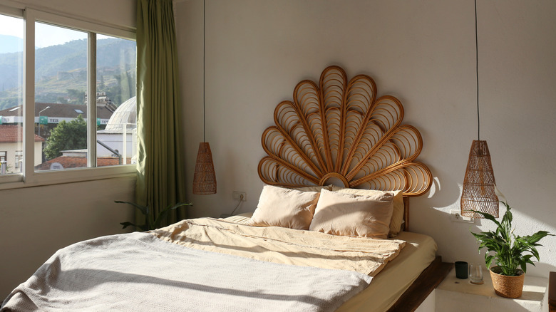 An intricate bamboo headboard in a boho style room