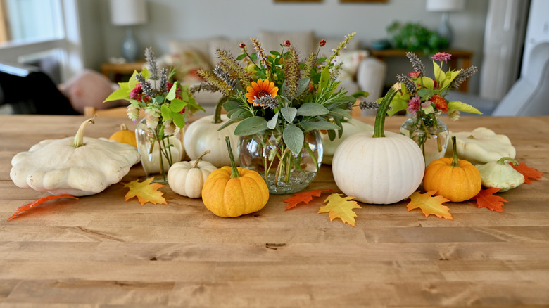 A Thanksgiving centerpiece made of pumpkins