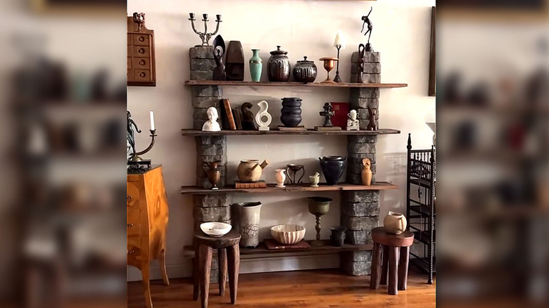 A screenshot of the video showing off the shelf made of just wood and pavers