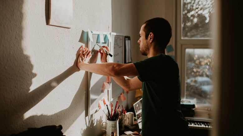 person using a dry erase at home