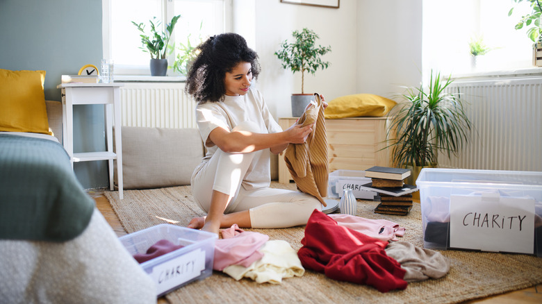 woman sorting through items