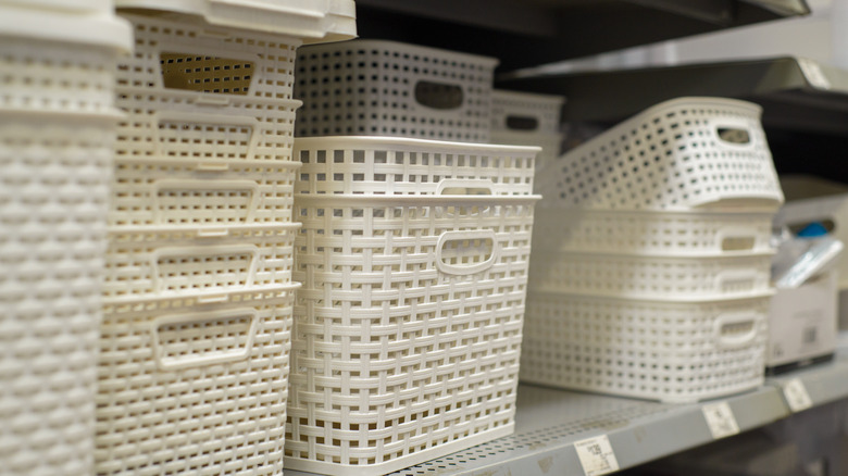 White plastic storage baskets on a store shelf