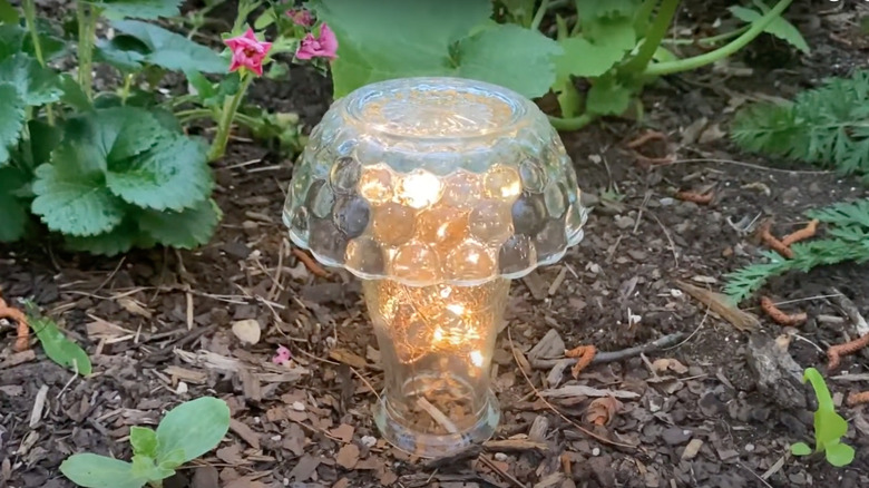 DIY glass mushroom light in garden