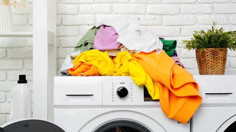 laundry on top of a washing machine