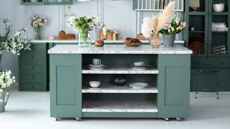 A kitchen island with plenty of built-in shelving.