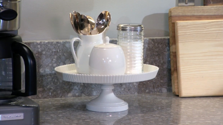 Martha Stewart demonstrates how she uses a cake stand to display her most-used kitchen items.