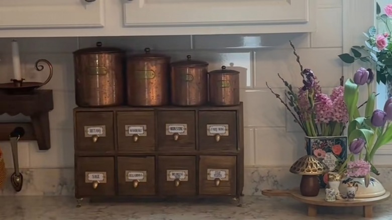 Small apothecary cabinet on kitchen countertop