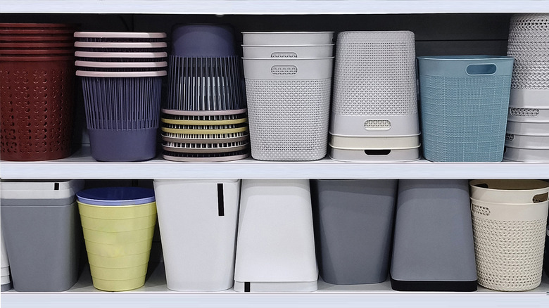 Plastic storage bins on a store shelf.
