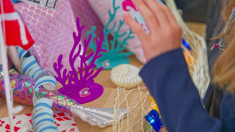 person DIYing coral themed decor