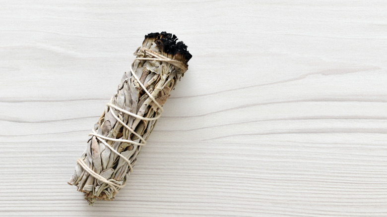 A dried sage bundle wrapped in string