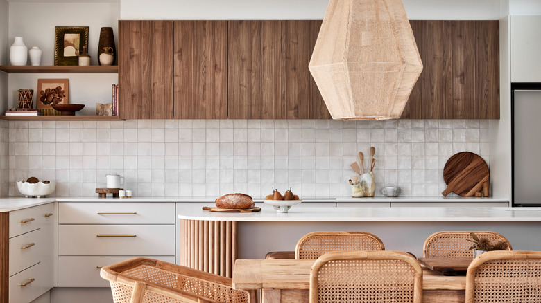 A beachy white kitchen with zellige tiles.