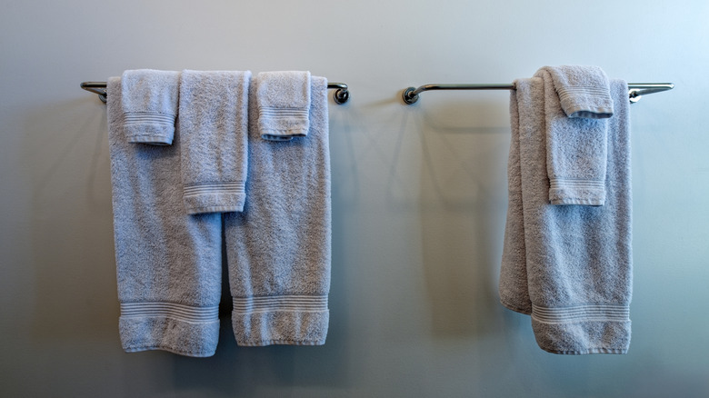 Towels hanging on bathroom rack.
