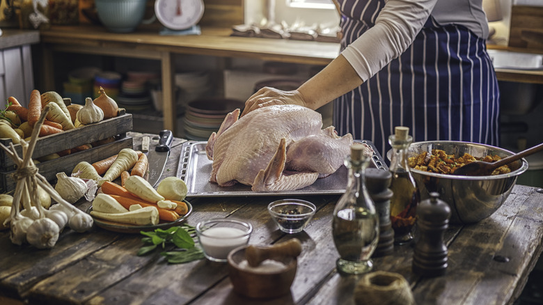 Prepping turkey on kitchen table