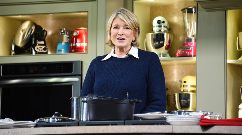 Martha Stewart speaking in a staged KitchenAid kitchen with appliances in the background