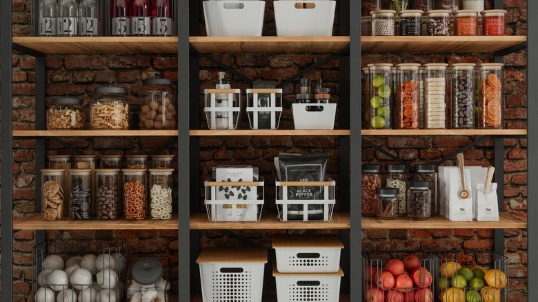 Shelves organized with glass jars and baskets