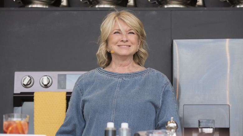 Martha Stewart smiling inside kitchen