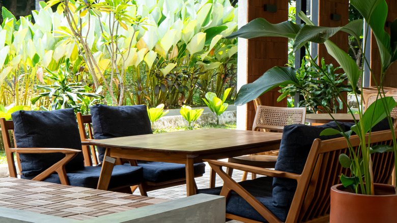 A shady outdoor dining space.