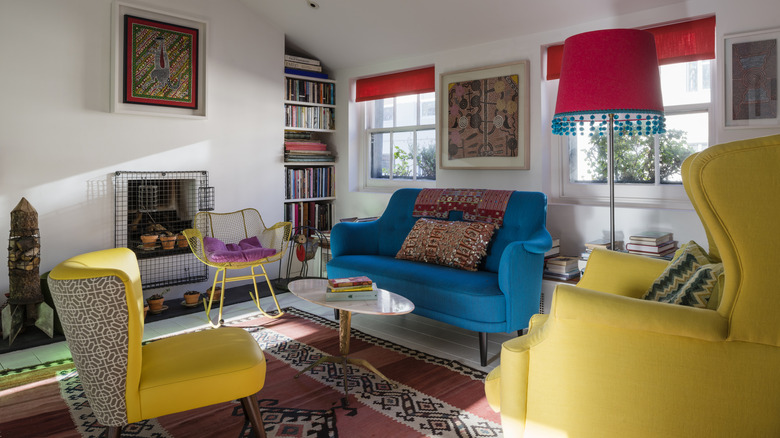 An eclectic living room with bright furniture.