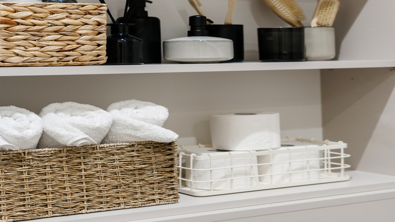 Zoomed in image of bathroom shelf with toiletries and soap
