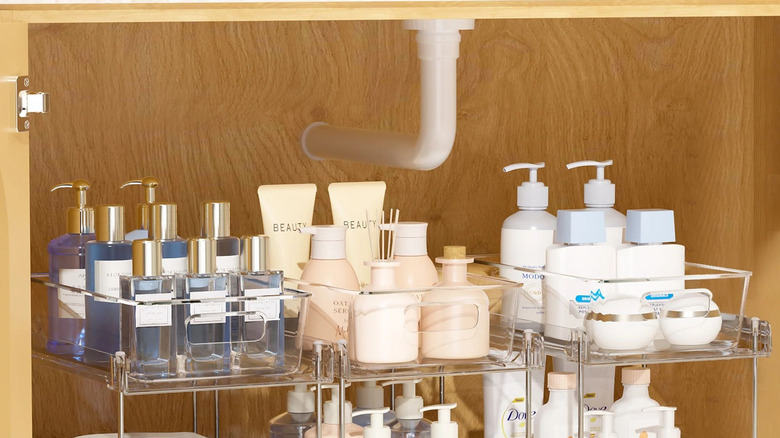 Open bathroom vanity with acrylic storage under-sink containers