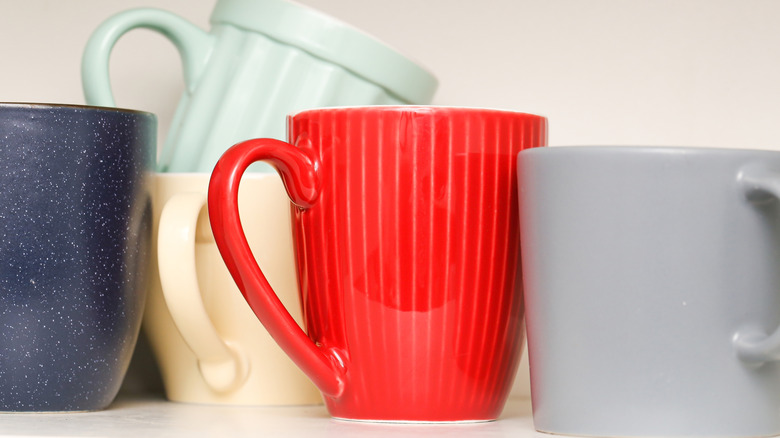 Mugs in a cabinet