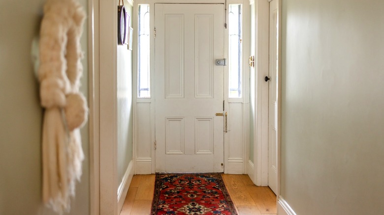 Narrow entryway in home with limited storage space