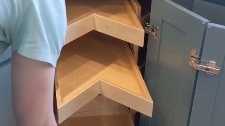 Pull-out shelves in a corner cabinet lazy Susan make the entire corner accessible