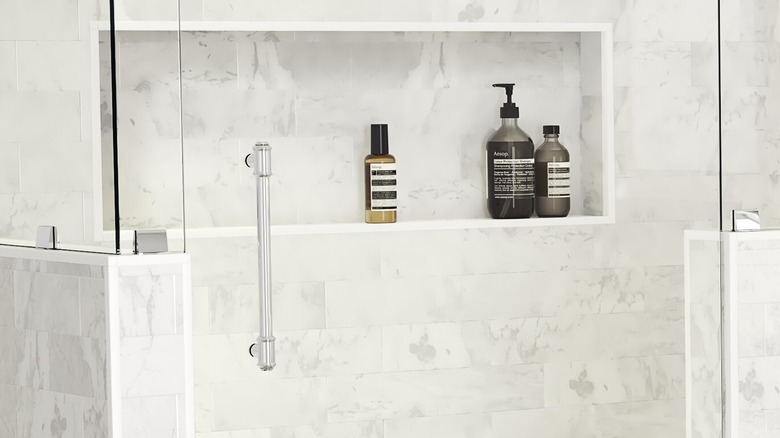 Niche in gray tiled shower
