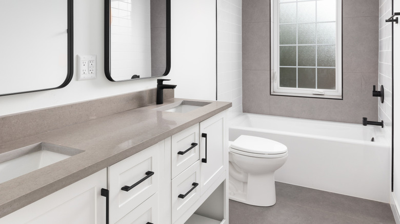 Bathroom with greige quartz counterops
