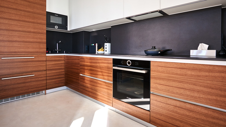 Modern kitchen with walnut veneer kitchen cabinets