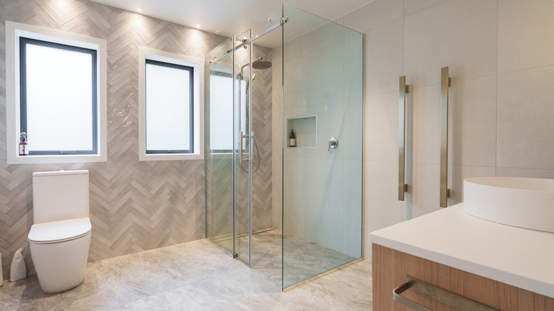 A curbless shower with a sliding door