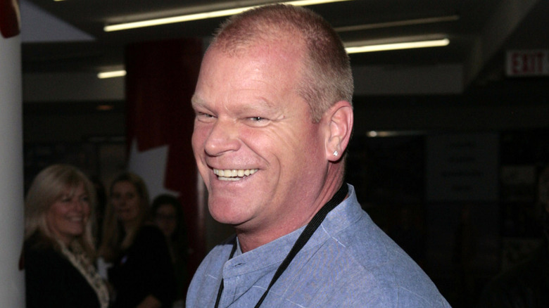 Mike Holmes smiling at an event