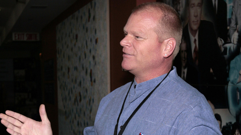 Mike Holmes in profile wearing a blue shirt