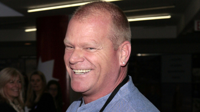 Mike Holmes smiles while attending an event