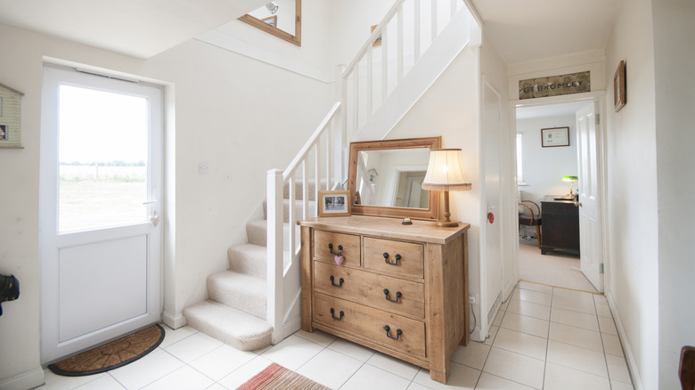 A floor plan of a living space that has a bedroom, full bath, and kitchen on the same floor.,