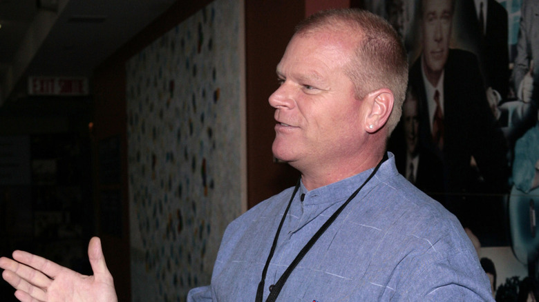 Mike Holmes in profile wearing a blue shirt
