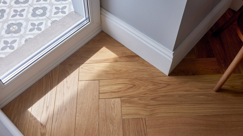 Light hardwood floor in corner